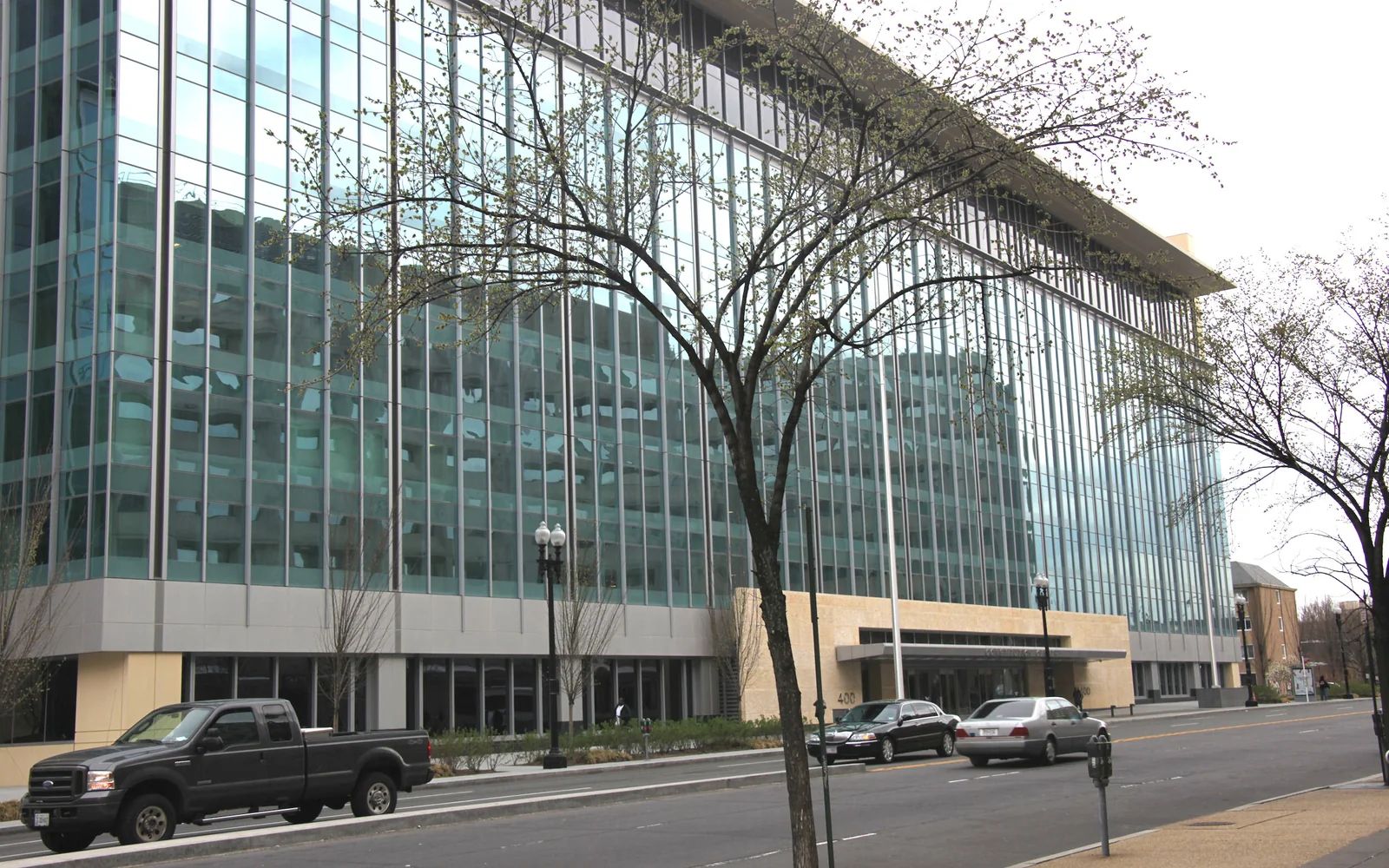The glass west facade of Constitution Center in Washington, D.C., photographed from across the street.